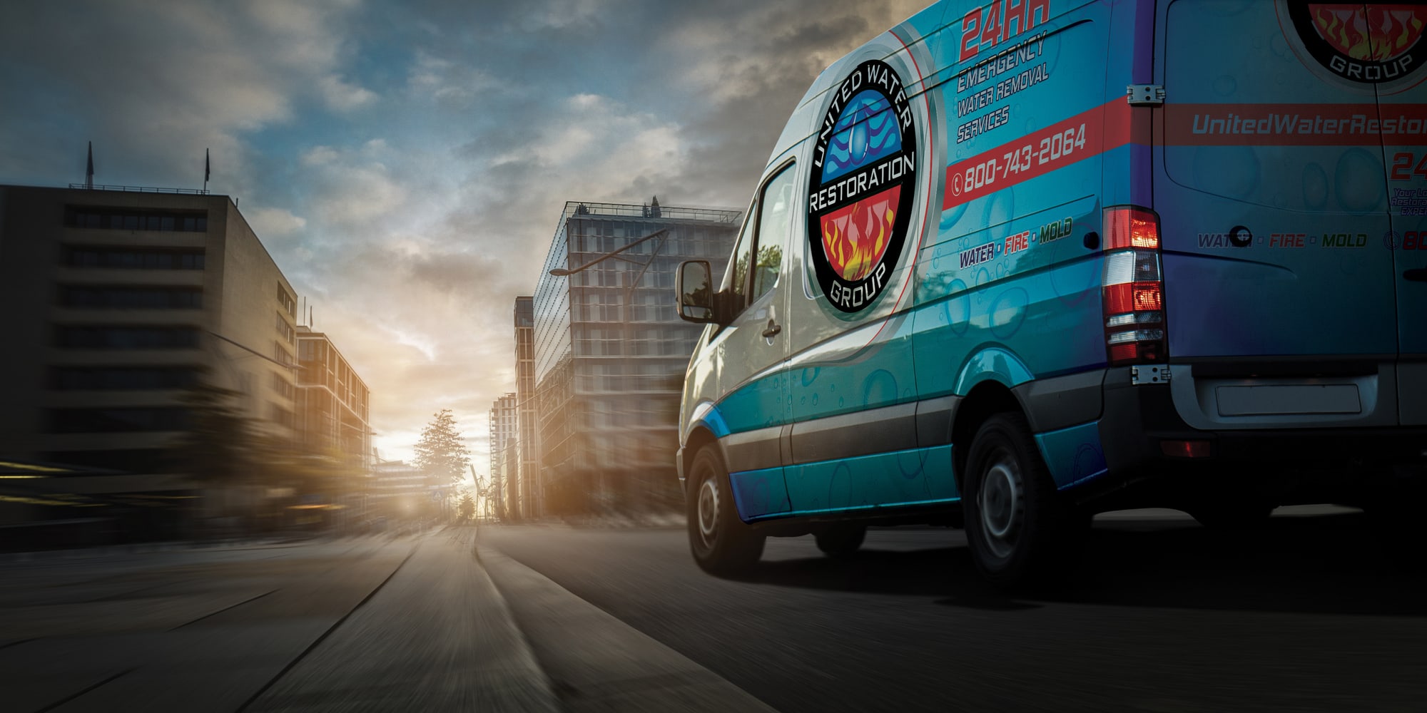 A United Water Restoration Group of Iowa City van heading out on an emergency call at sunset