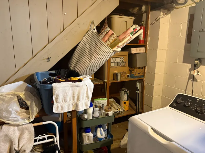 Basement laundry area affected by water damage
