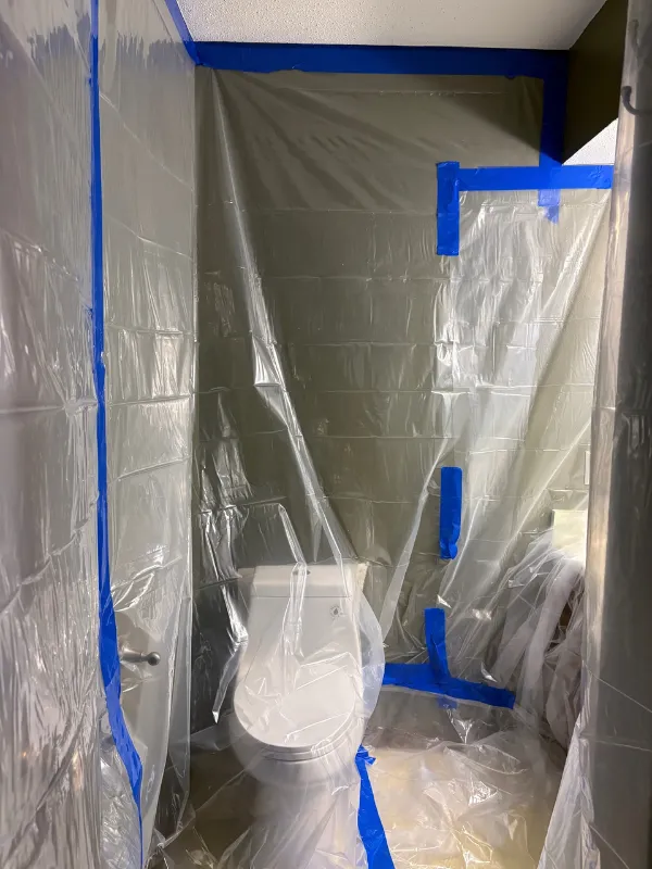 Bathroom sealed in containment plastic during mold remediation