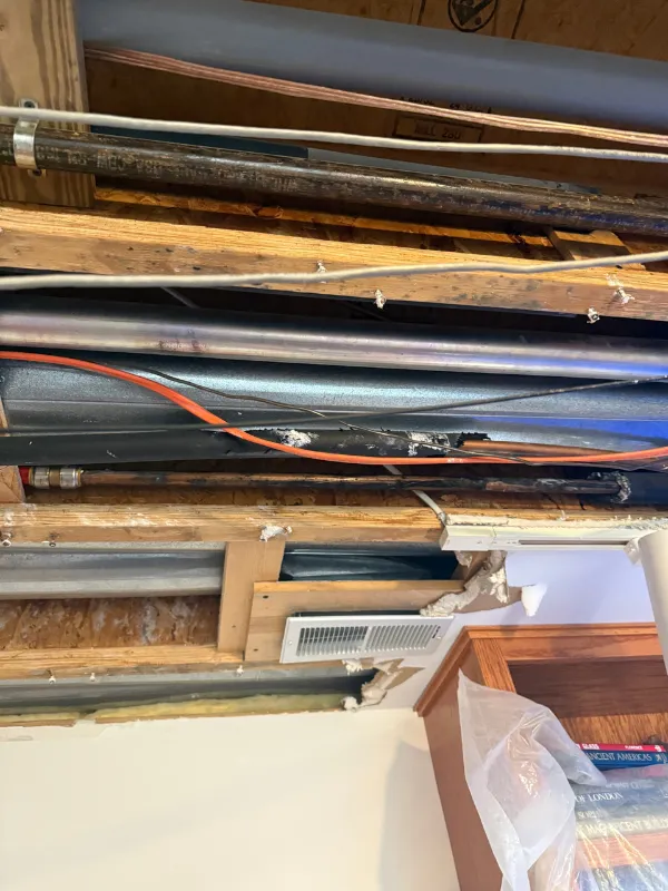 Ductwork and supply lines running under exposed floor joists