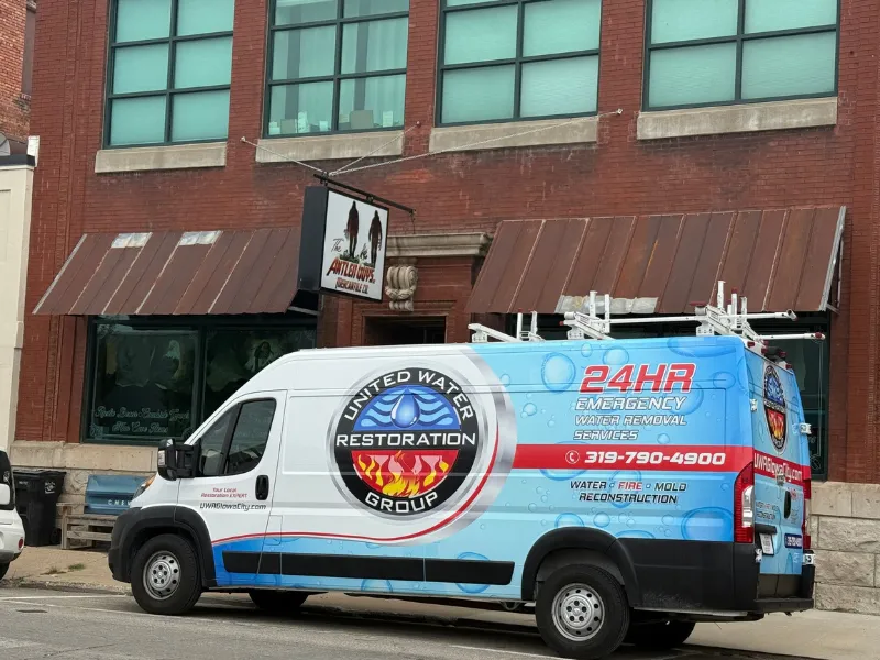 Service van parked outside a downtown commercial building
